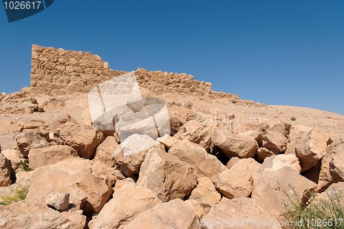Image of Ruins of ancient tower on desert hill 