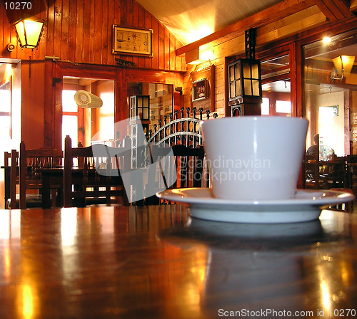 Image of Coffee cup in a pub with lights