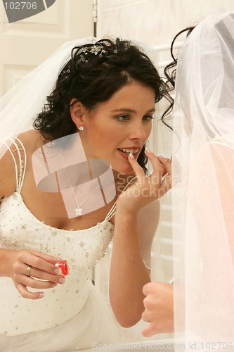 Image of Wedding Bride doing makeup