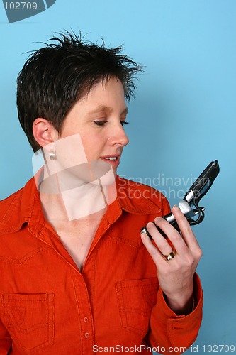 Image of Woman holding her phone