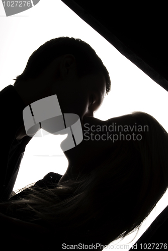 Image of Young couple kissing    