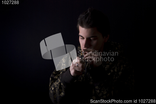 Image of portrait of a young man with cigarette  