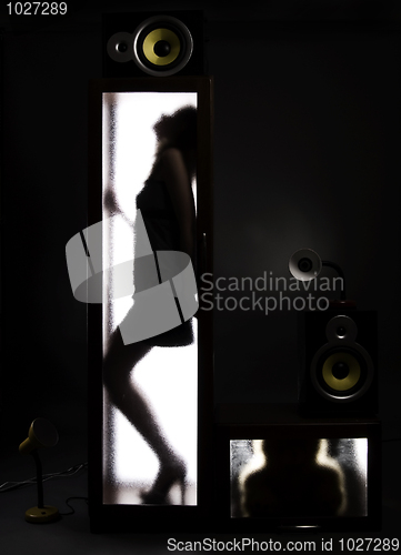 Image of A girl behind the glass door            