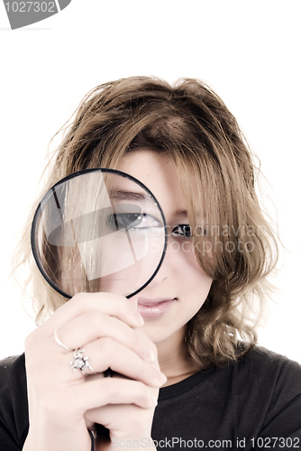 Image of young girl with magnifying glass  