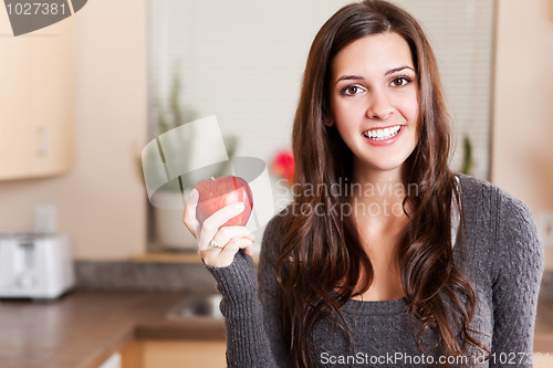 Image of Woman holding apple