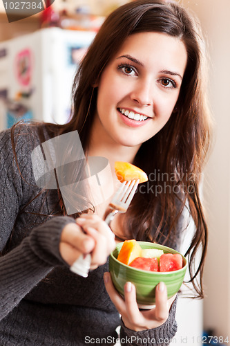 Image of Woman holding a fruit bowl