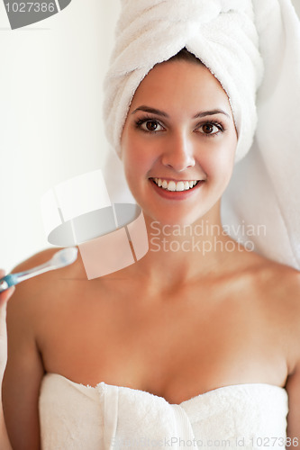 Image of Woman holding tooth brush