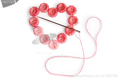 Image of Heart of the buttons with needle