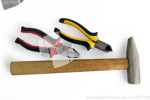 Image of Pliers, side cutters and a hammer