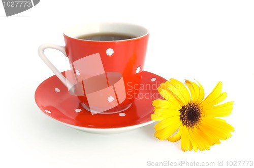 Image of Red coffee cup with a yellow flower