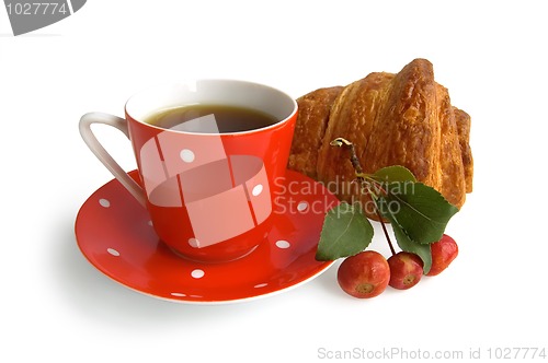 Image of Red coffee cup with croissant and apple