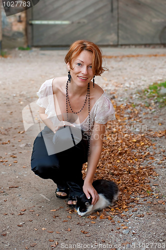 Image of Beautiful woman with cat