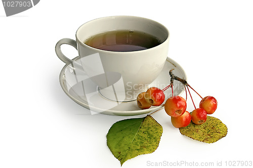 Image of Tea in a white bowl with apples