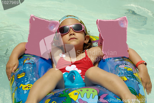 Image of Child in pool relaxing