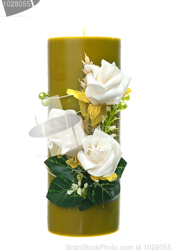 Image of Large green candle with the flower decoration