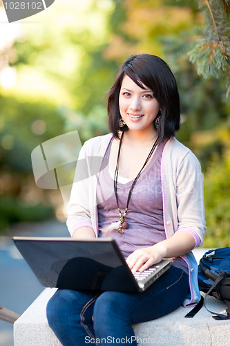 Image of Mixed race college student with laptop