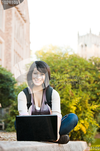 Image of Mixed race college student with laptop