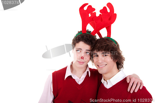Image of happy young men wearing reindeer horns, on white, studio shot