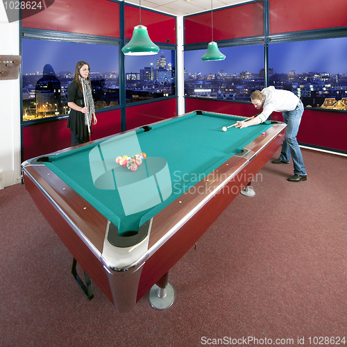 Image of Two people playing pool