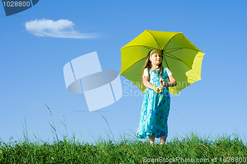 Image of Girl at meadow with umbrella