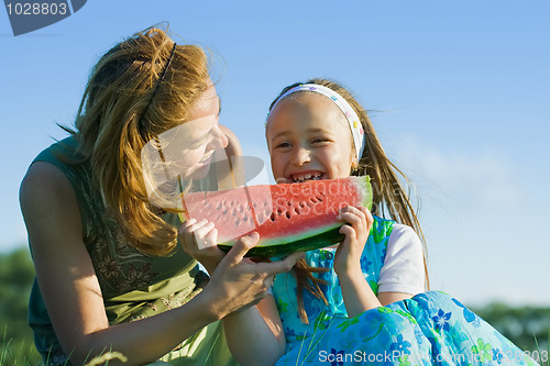 Image of Happy child eating watermelon