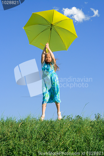 Image of Girl at meadow with umbrella