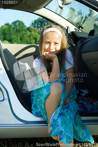 Image of Girl sitting in car
