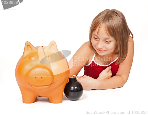 Image of Little girl exploding piggy bank