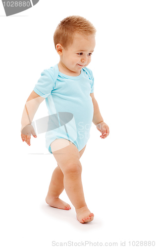 Image of Baby boy walking slyly