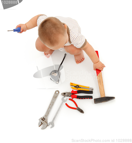 Image of Little boy with tools