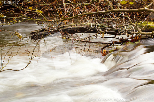 Image of Falls on the small mountain river in a wood shooted in autumn