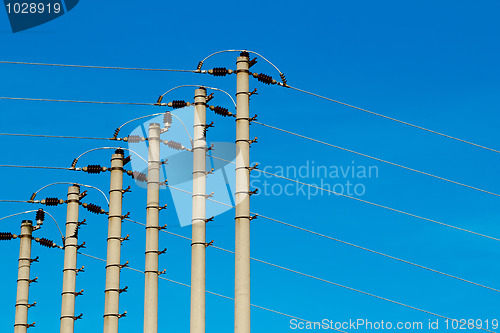 Image of High-voltage pole against a blue sky 