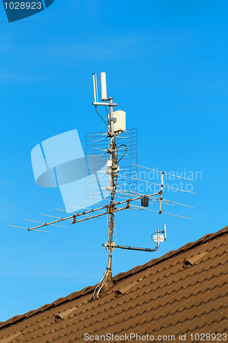 Image of television antenna and wi-fi transmitter on the roof