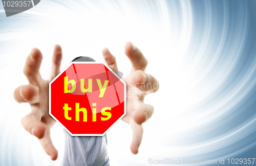 Image of Man grabing a red sign.