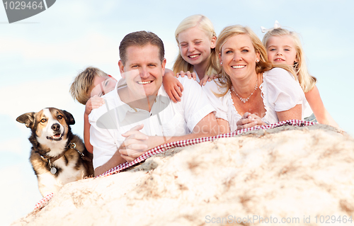 Image of Happy Caucasian Family and Dog Portrait at the Beach