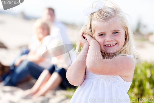 Image of Adorable Little Blonde Girl Having Fun At the Beach