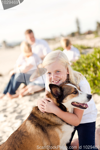 Image of Cute Girl Playing with Her Dog Outside