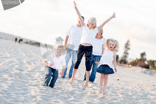 Image of Happy Sibling Children Jumping for Joy