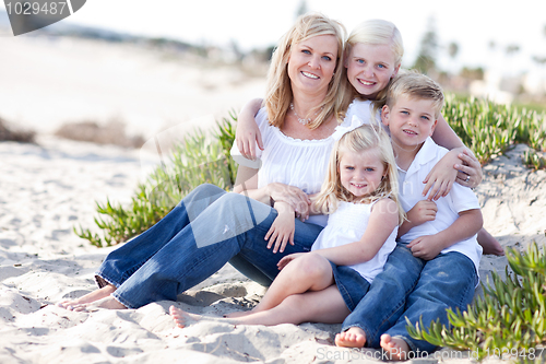 Image of Attractive Mom and Her Cute Children at The Beach