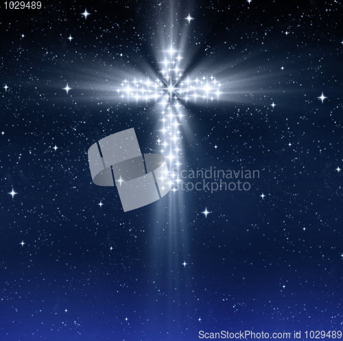 Image of glowing religious cross in stars