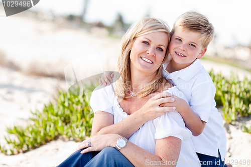 Image of Cute Son Hugs His Mom at The Beach