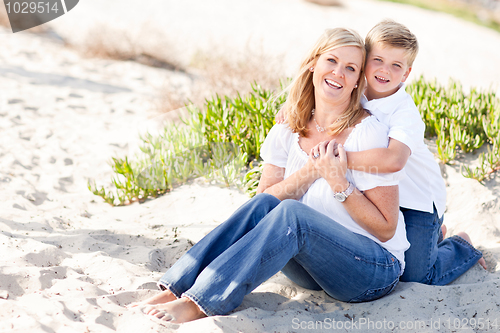 Image of Cute Son Hugs His Mom at The Beach