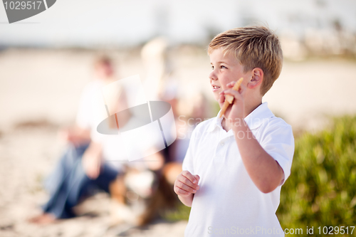 Image of Cute Little Blonde Boy Showing Off His Starfish