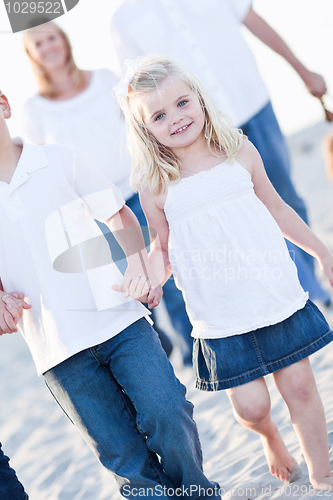 Image of Adorable Little Girl Walking With Her Family