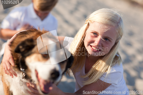 Image of Cure Girl Playing with Her Dog