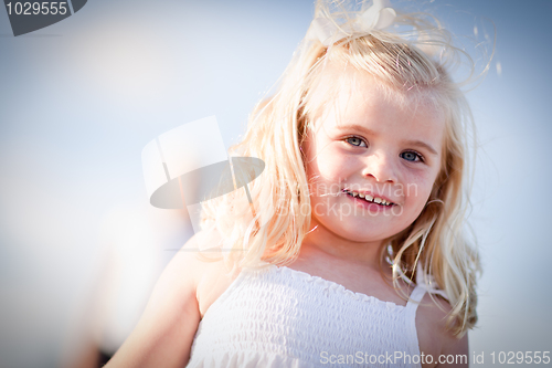 Image of Adorable Blue Eyed Girl Playing Outside