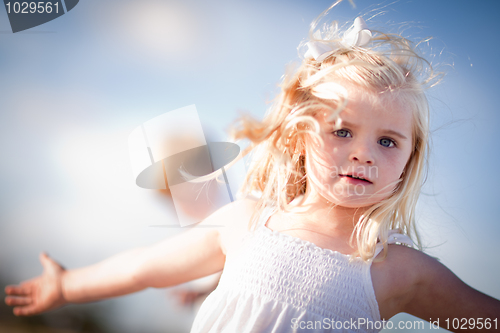 Image of Adorable Blue Eyed Girl Playing Outside