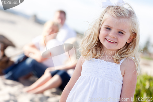 Image of Adorable Little Blonde Girl Having Fun At the Beach