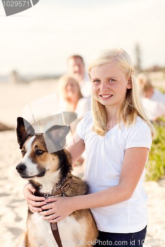 Image of Cure Girl Playing with Her Dog Outside