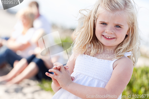 Image of Adorable Little Blonde Girl Having Fun At the Beach